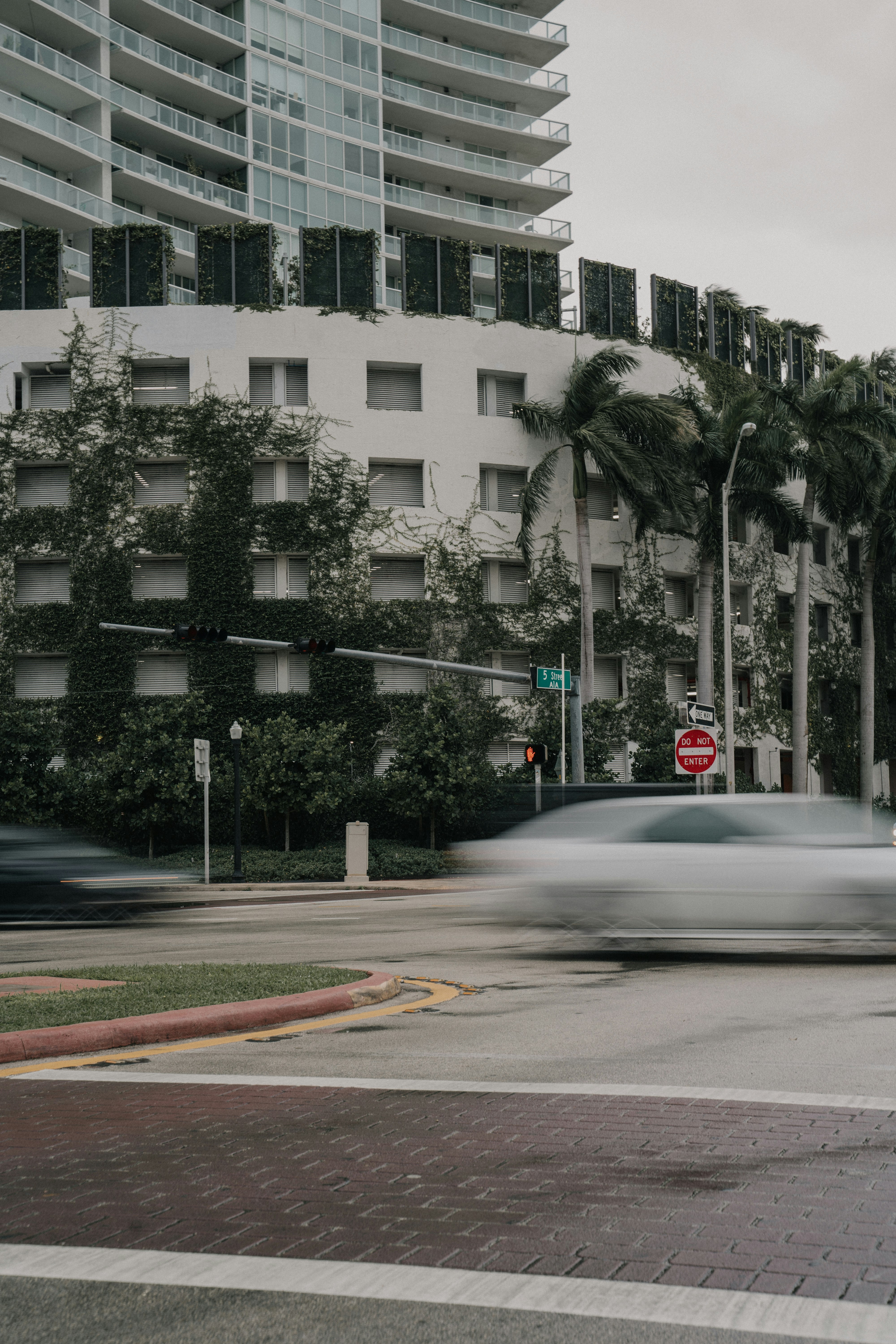 white concrete building beside road during daytime